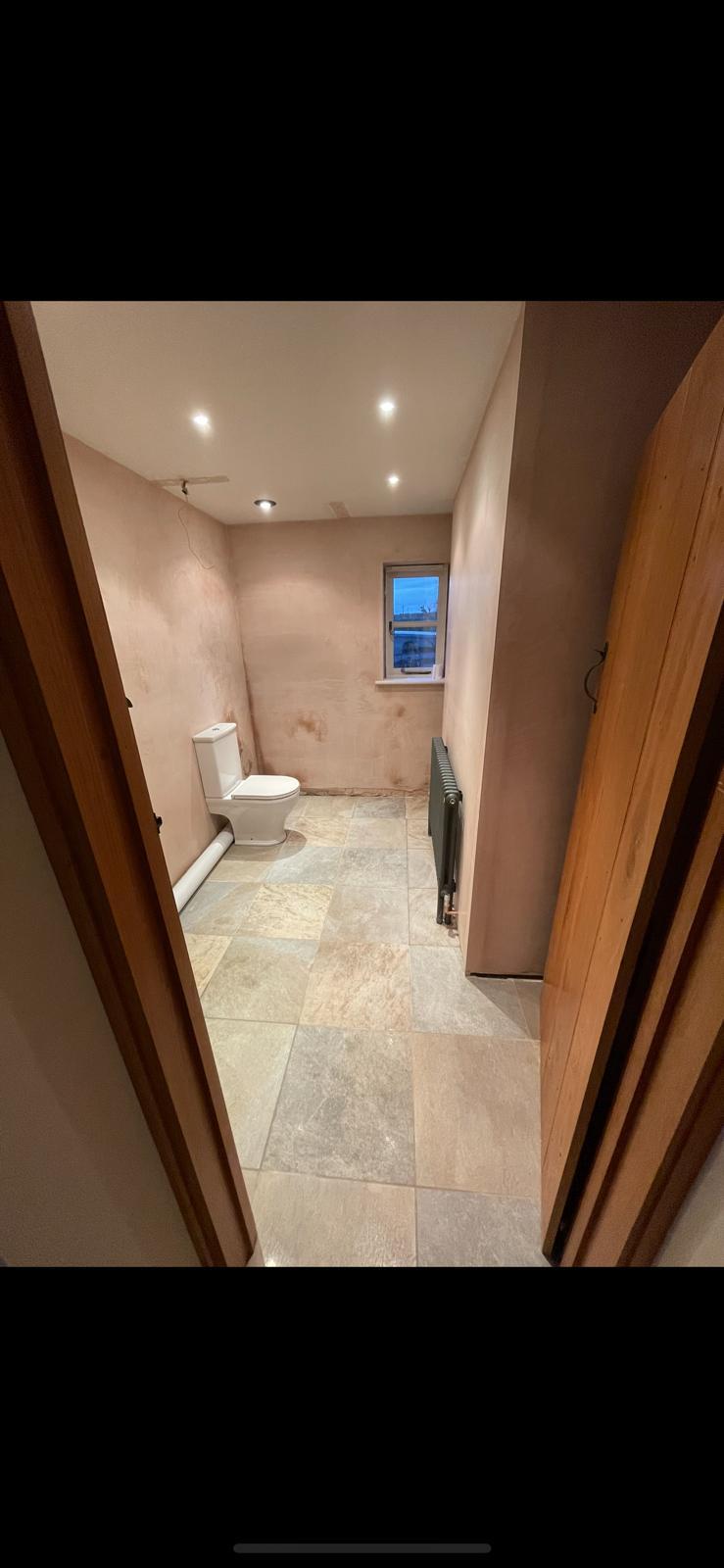 Freshly plastered loft room with exposed beam and velux window — Malvern and Worcester Plastering