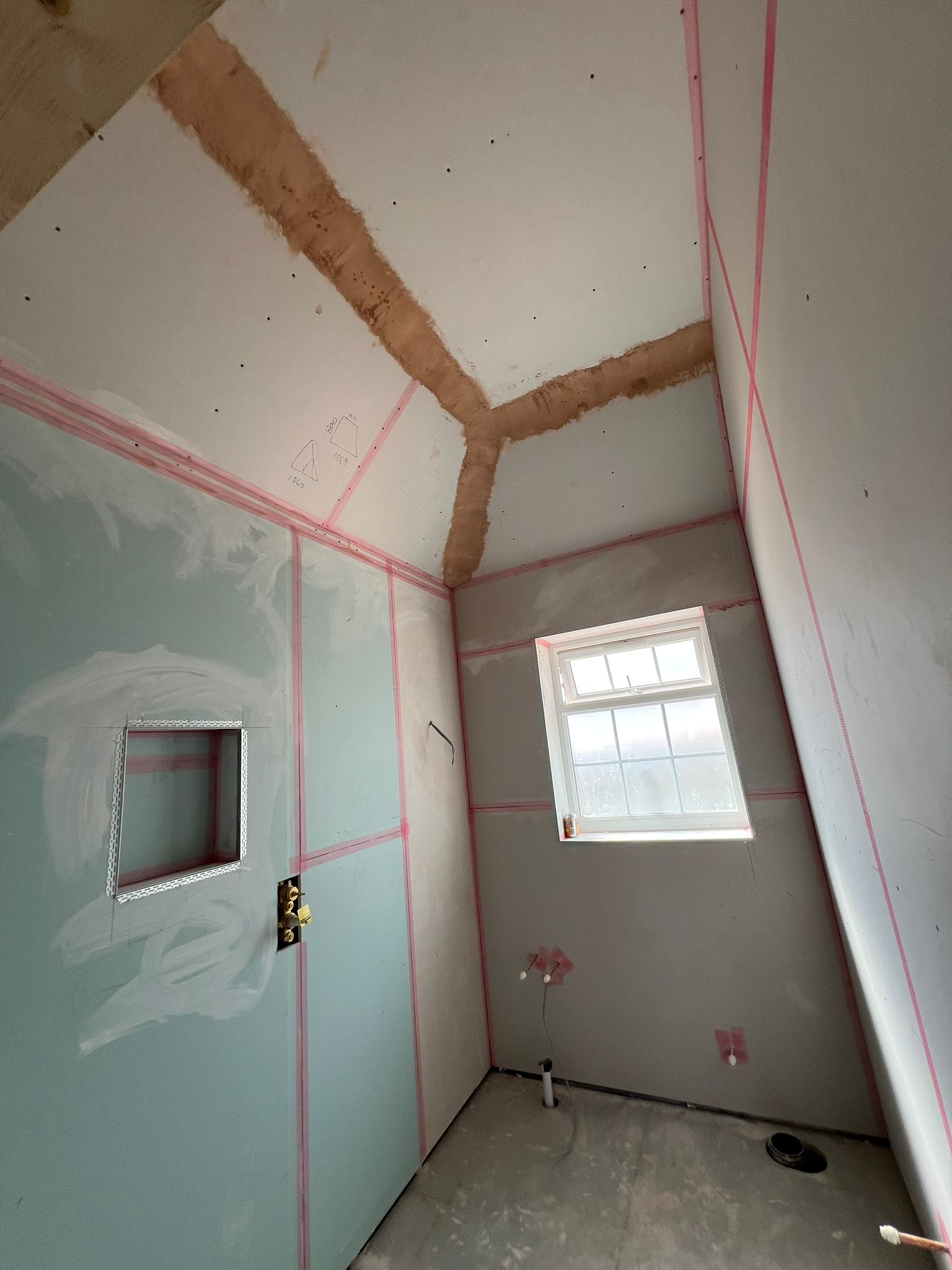 Moisture-resistant boarding in bathroom with vaulted ceiling