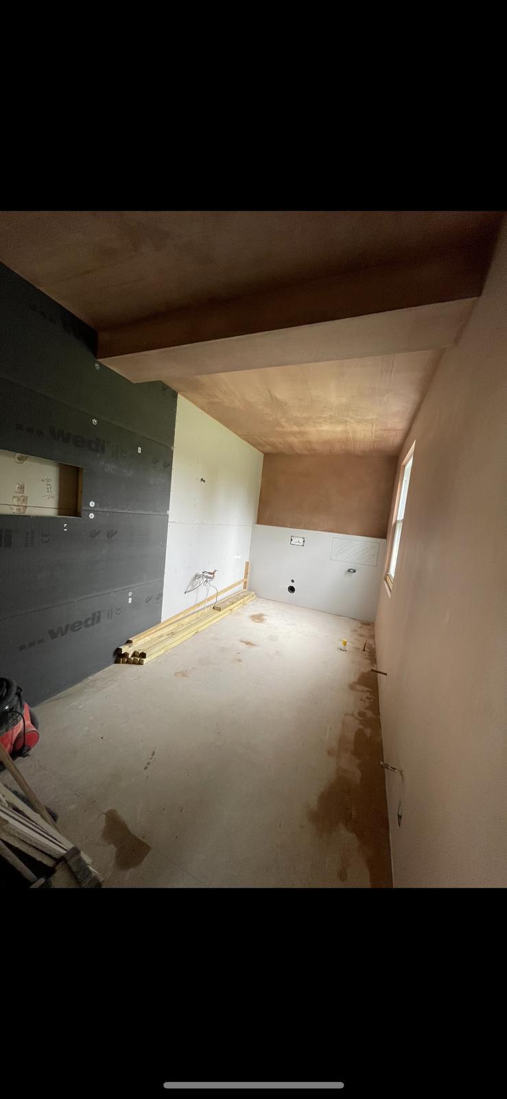 Large bathroom with Wedi board walls and freshly skimmed ceiling